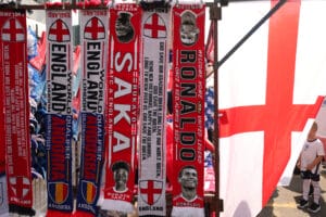 LONDON, ENGLAND - SEPTEMBER 05: A merchandise stall selling a scarf for Manchester Uniteds Cristiano Ronaldo during the 2022 FIFA World Cup Qualifier between England and Andorra at Wembley Stadium on September 5, 2021 in London, England. (Photo by James Williamson - AMA/Getty Images)