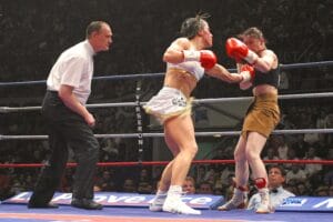 Defending champion Myriam Lamare of France (L) and Elena Tverkholev of Ukraine during their Light Welterweight WBA world title fight at the Palais des Sports in Marseille, southern France, on April 29, 2005. Photo by Gerald Holubowicz/ABACA.
