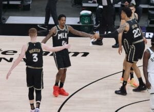 Atlanta, USA. 29th June, 2021. The Atlanta Hawks', from left, Kevin Huerter, Lou Williams, and John Collins celebrate an early lead against the Milwaukee Bucks in Game 4 of the Eastern Conference Finals on Tuesday, June 29, 2021, at State Farm Arena in At