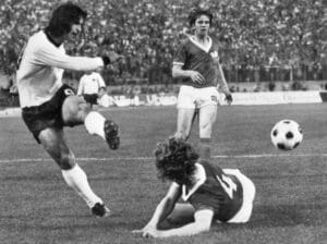 West German forward Gerd M?ller kicks the ball pas