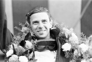 Jim Clark, British Formula One racing driver for Lotus-Climax, pictured celebrating after winning British Grand Prix at Brands Hatch, 10th July 1964.
