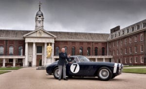 Sir Stirling Moss with the 1961 Rob Walker Ferrari 250 SWB he drove to victory in 1961 TT