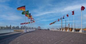 The FIFA World Cup Qatar 2022 Official Countdown Clock  at Doha?s picturesque Corniche Fishing Spot with flags of participating countries