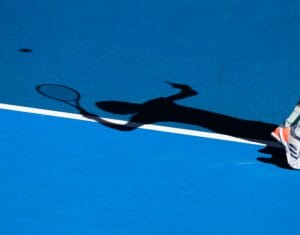 Shadow of German tennis player Alexander Zverev playing service shot,Australian Open 2020 tennis tournament, Melbourne Park, Melbourne, Victoria, Aust