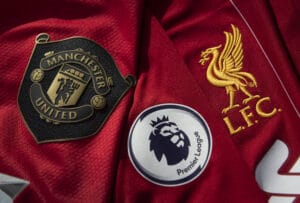 The Manchester United and Liverpool Club Badges with the Premier League Logo