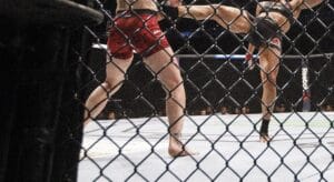 Amanda Nunes of Brazil, right, kicks Valentina Shevchenko of Kyrgyzstan during their mixed martial arts bout at UFC 215 in Edmonton, Alta., on Saturday September 9, 2017. THE CANADIAN PRESS/Jason Franson