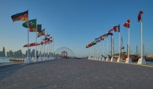 The FIFA World Cup Qatar 2022 Official Countdown Clock  at Doha?s picturesque Corniche Fishing Spot with flags of participating countries