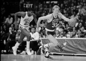 Boston Celtics Hall of Famer Larry Bird brings the ball up against the Chicago Bulls during a game at the Chicago Stadium in 1985.