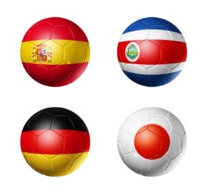 Soccer balls with group E teams flags, Football competition Qatar 2022. 3D illustration isolated on white background